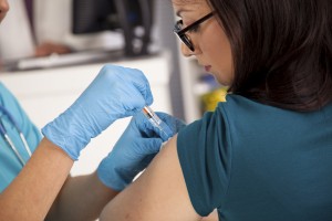 lady receiving vaccination, shot, vaccination birth defect attorneys